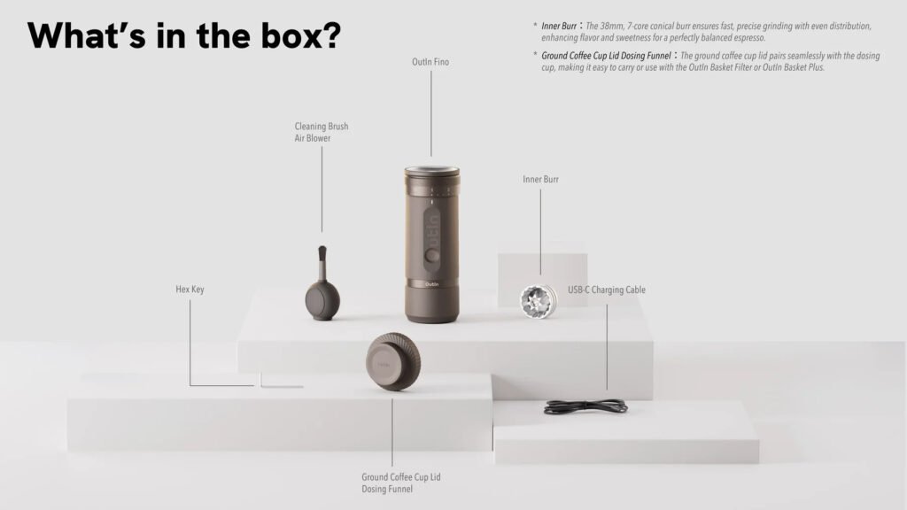 OutIn Fino portable electric coffee grinder unboxing showing main unit, USB charging cable, cleaning brush, and user manual included in the box