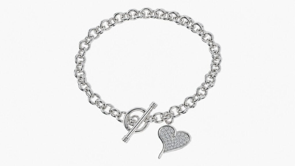 Sterling silver toggle bracelet with heart charm and ALTR lab-grown diamonds, featuring modern luxury streetwear-inspired jewelry styling.